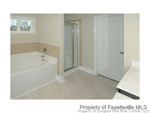 158 Shellbark Drive Spring Lake, NC 28390 - Photo 9 of 15 a bathroom with a black tub