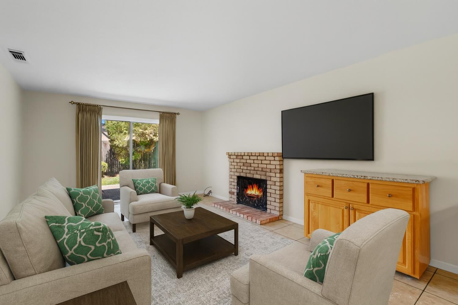 9057 Caldera Way Sacramento, CA 95826 - Photo 17 of 52 Family room, newly painted interior and a great, cozy room complete with access to back yard and a fireplace.