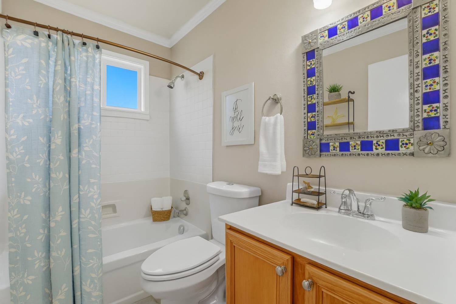 9057 Caldera Way Sacramento, CA 95826 - Photo 34 of 52 Hall bath was recently upgraded with a new shower and subway tile added, newer updated sink and cabinet, newer windows throughout this darling home.