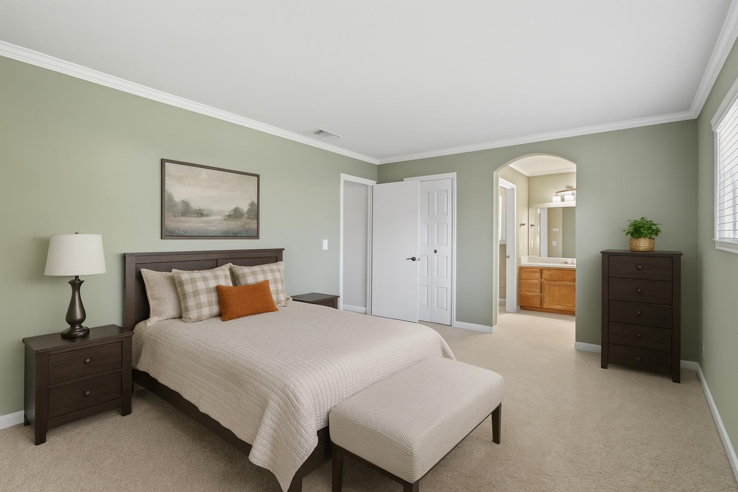 9057 Caldera Way Sacramento, CA 95826 - Photo 38 of 52 Large primary suite with crown molding and dual closets, bright with newer windows throughout.