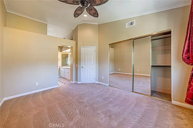 a view of an empty room with a chandelier