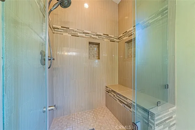a bathroom with a bathtub and shower