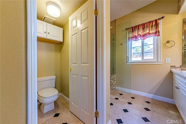 a bathroom with a toilet sink and a shower