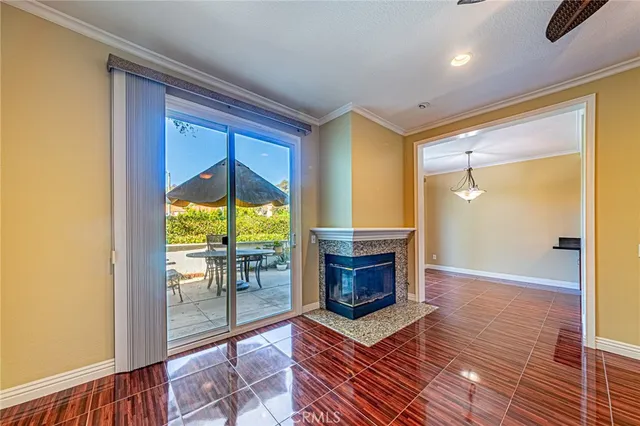 a view of room with window and wooden floor