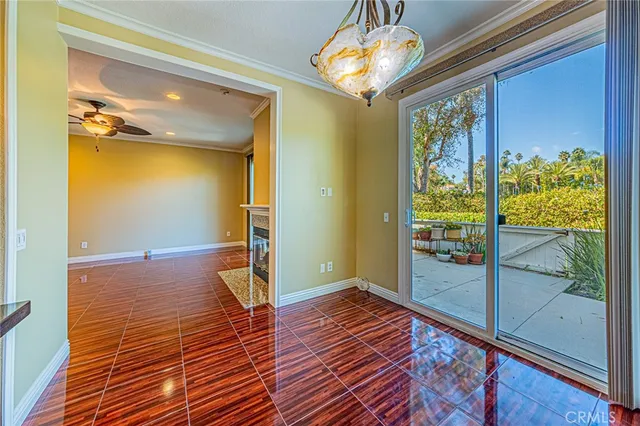 a view of a room with wooden floor and door