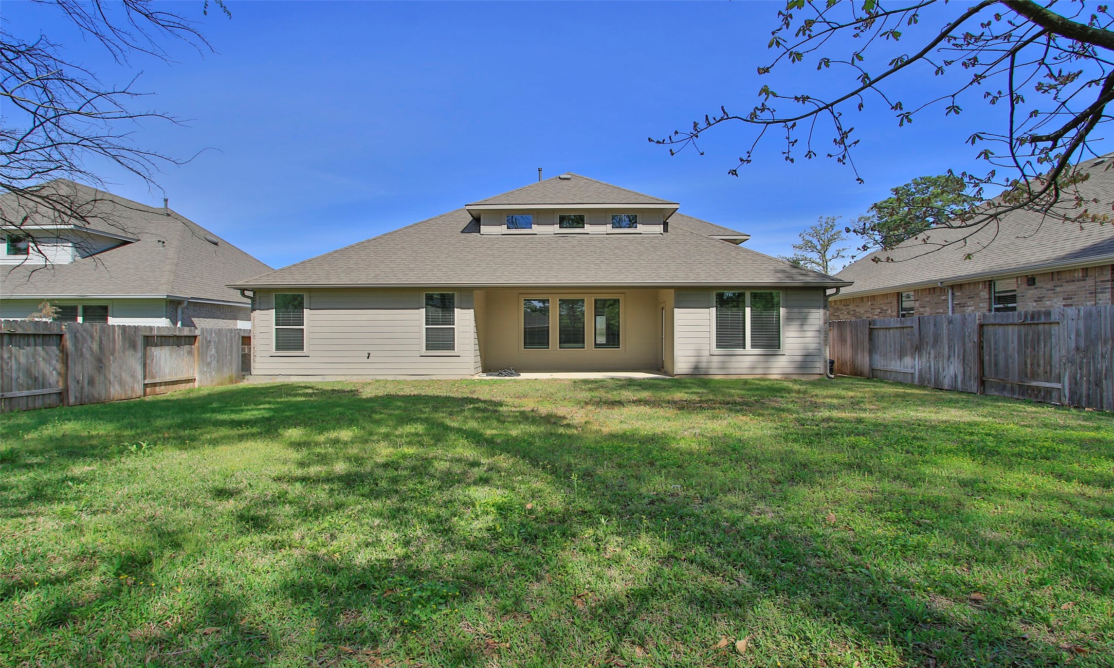 14120 Sand Ridge Court Conroe, TX 77384 - Photo 40 of 43 a front view of a house with a garden