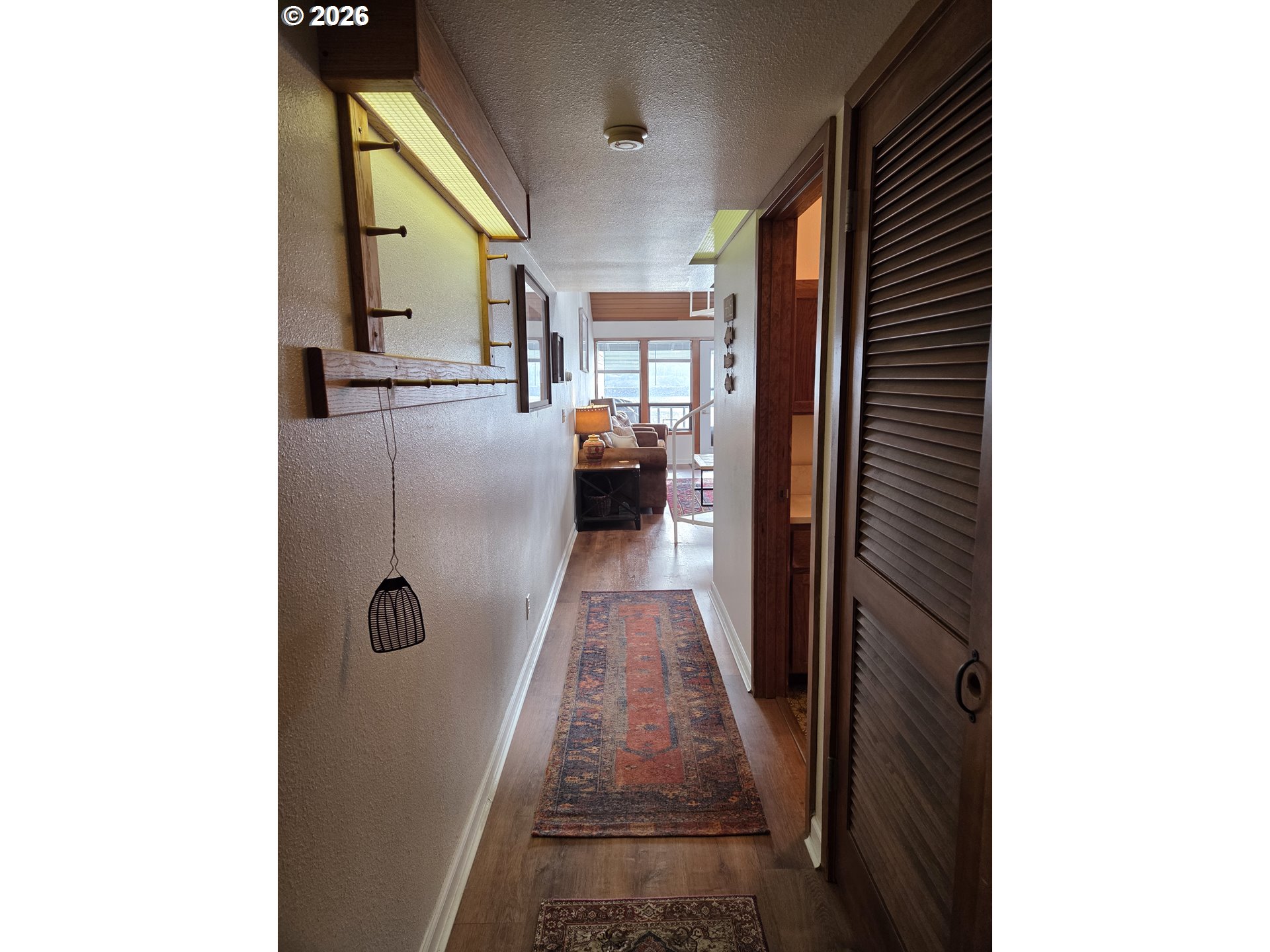 94304 Wedderburn Loop, Unit 437 Gold Beach, OR 97444 - Photo 5 of 20 a en suite bathroom with a sink and mirror with shower