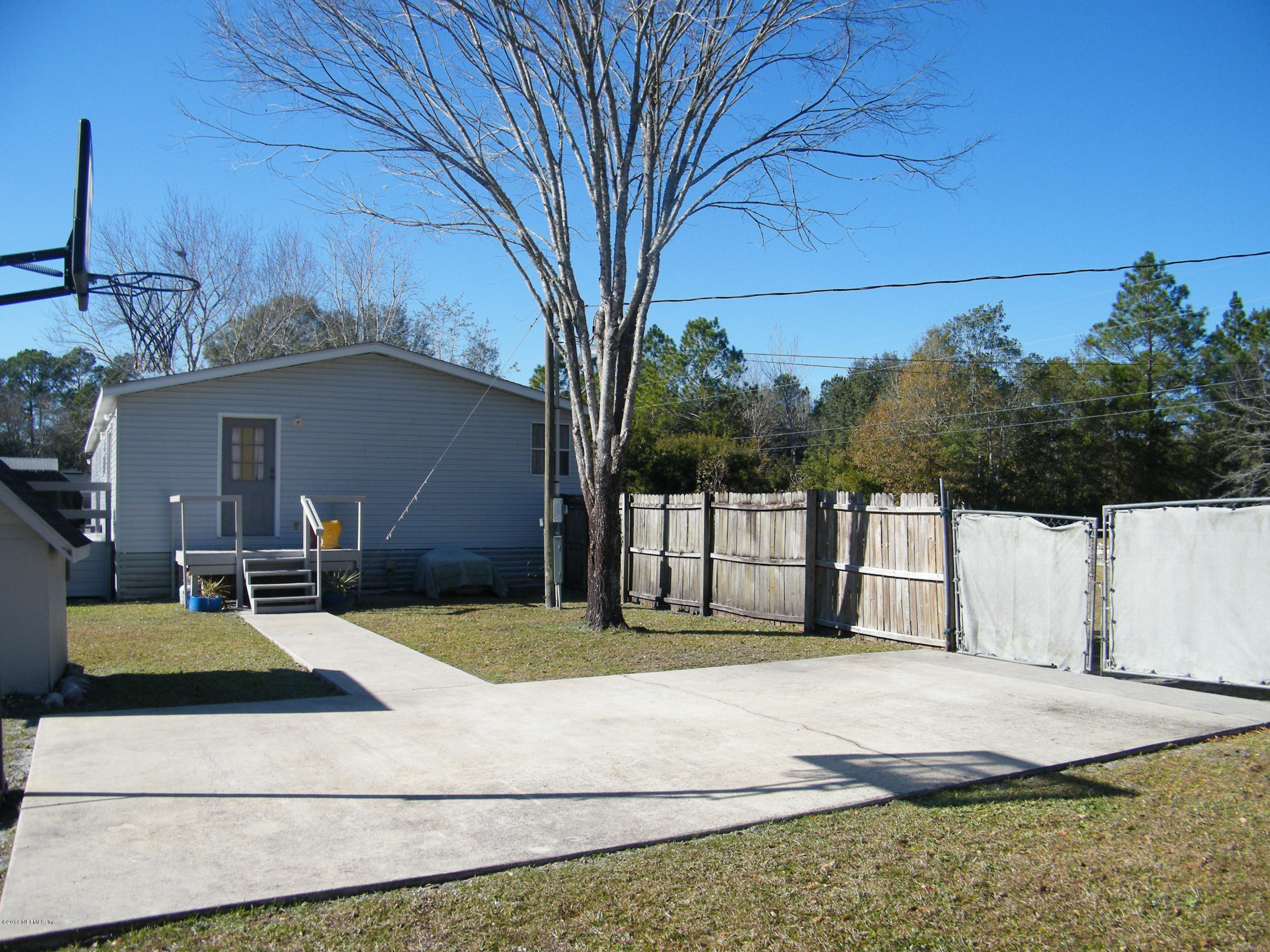 543 Kay Road Middleburg, FL 32068 - Photo 10 of 28 Side door to laundry room & parking pad