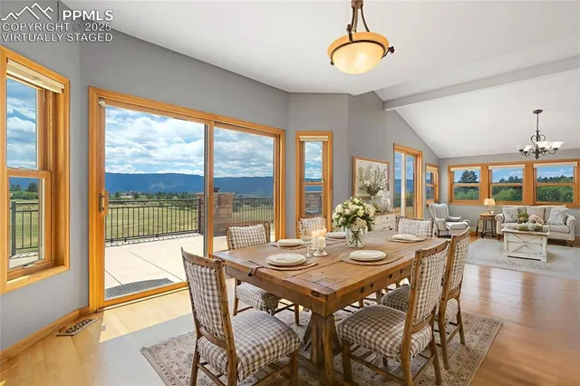 a view of a dining room with furniture window and outside view