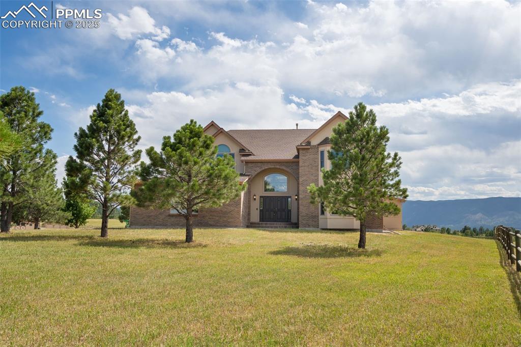 1680 Elk View Road Larkspur, CO 80118 - Photo 2 of 50 a house view with garden space