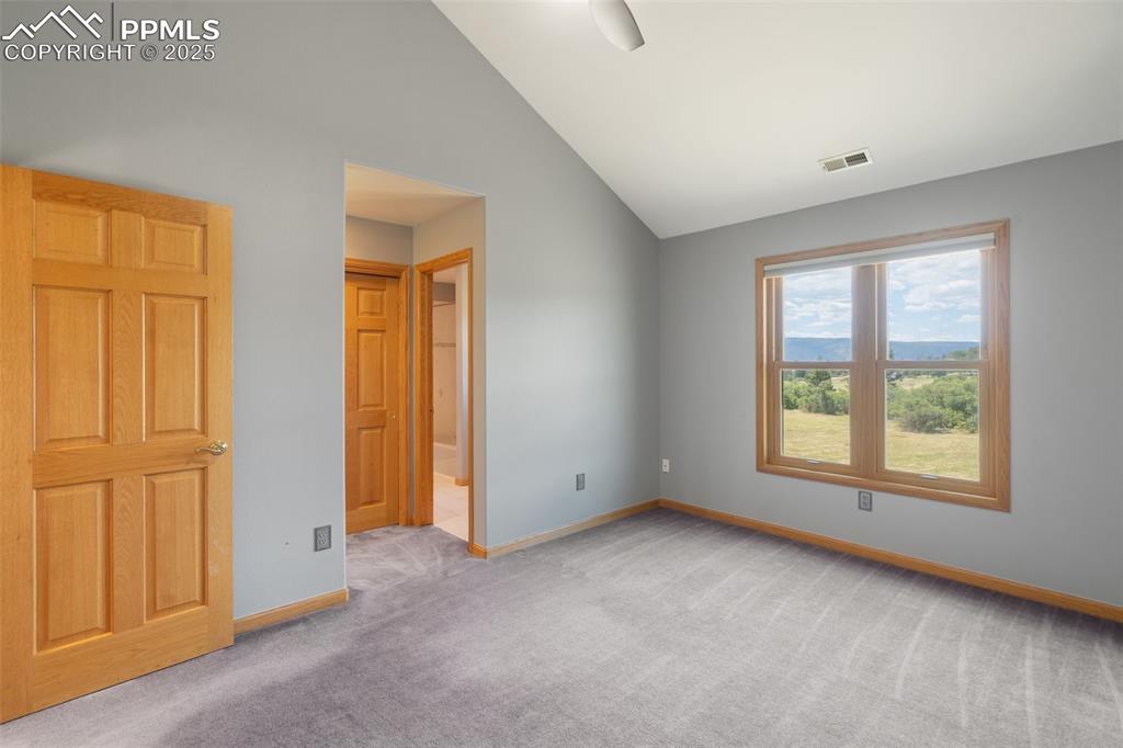 1680 Elk View Road Larkspur, CO 80118 - Photo 24 of 50 a view of an empty room with a window