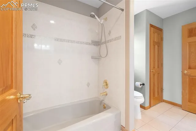 a bathroom with a shower and a tub