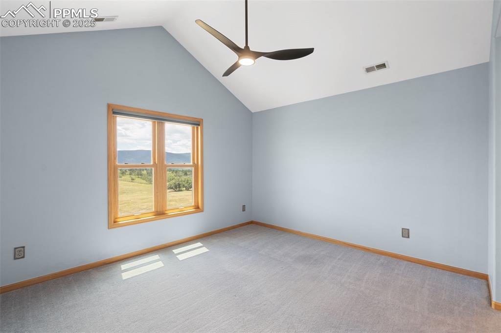 1680 Elk View Road Larkspur, CO 80118 - Photo 28 of 50 a view of an empty room with a window