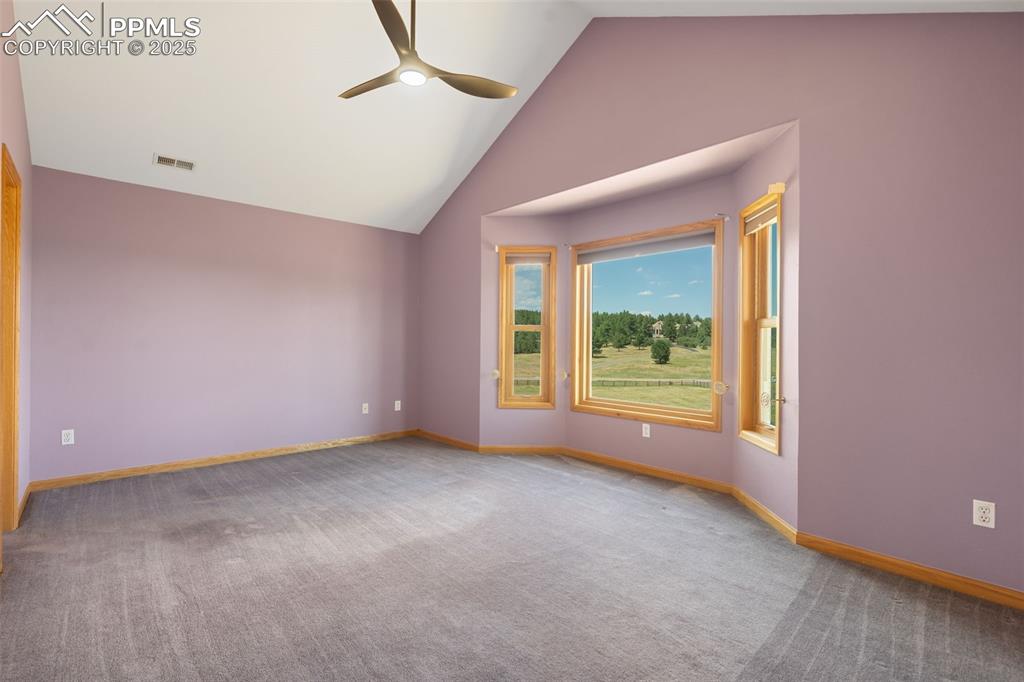 1680 Elk View Road Larkspur, CO 80118 - Photo 29 of 50 a view of an empty room with a window
