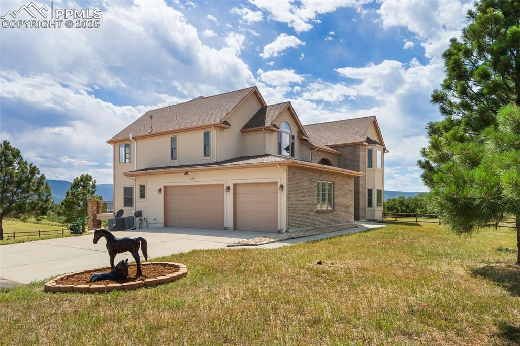 1680 Elk View Road Larkspur, CO 80118 - Photo 3 of 50 a house view with a garden space