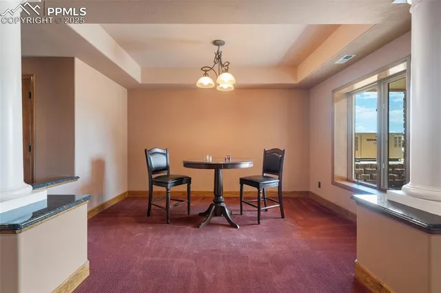 a view of a livingroom with furniture window and wooden floor