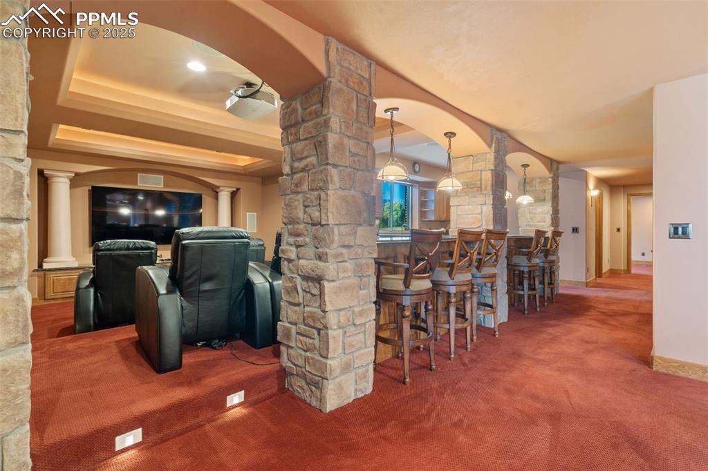 1680 Elk View Road Larkspur, CO 80118 - Photo 36 of 50 a dining room with furniture and a large window