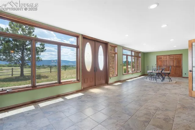 a view of livingroom with furniture and floor to ceiling window