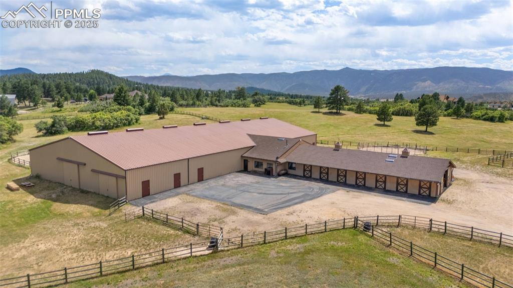 1680 Elk View Road Larkspur, CO 80118 - Photo 42 of 50 a view of a terrace with a lake view