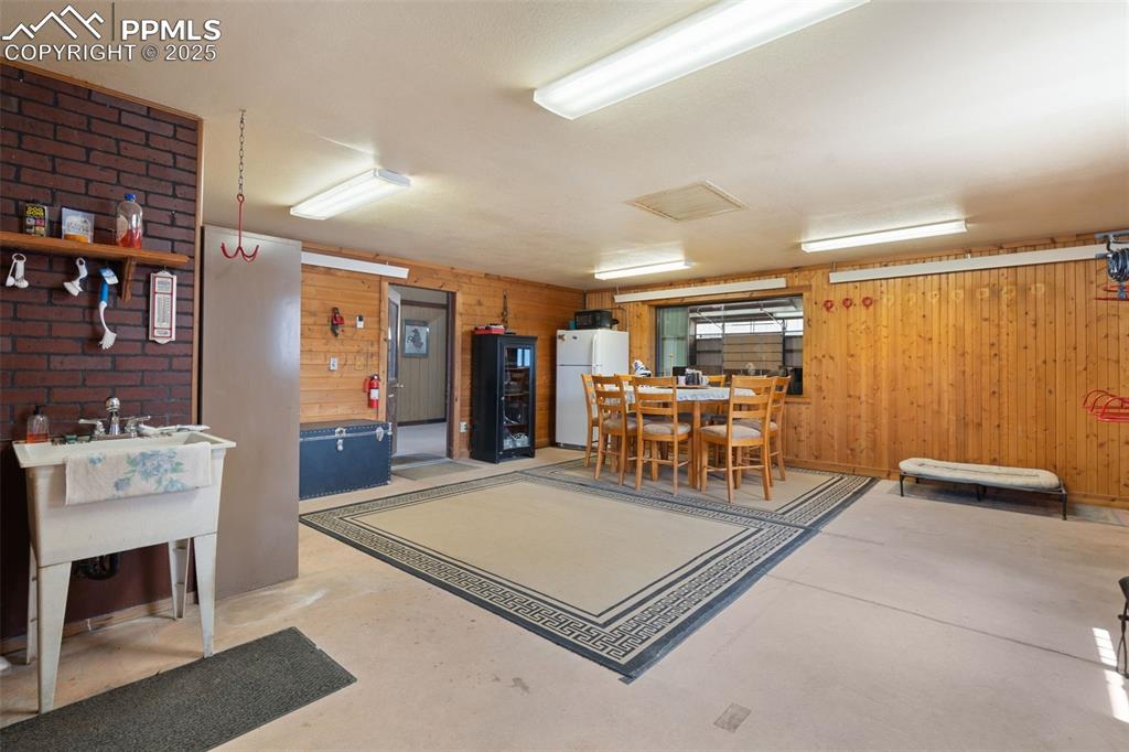 1680 Elk View Road Larkspur, CO 80118 - Photo 44 of 50 a living room with furniture and white walls