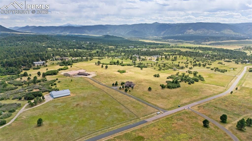 1680 Elk View Road Larkspur, CO 80118 - Photo 48 of 50 a view of a swimming pool with a mountain