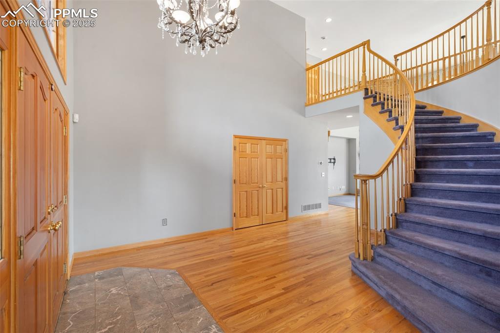 1680 Elk View Road Larkspur, CO 80118 - Photo 6 of 50 a view of entryway with wooden floor