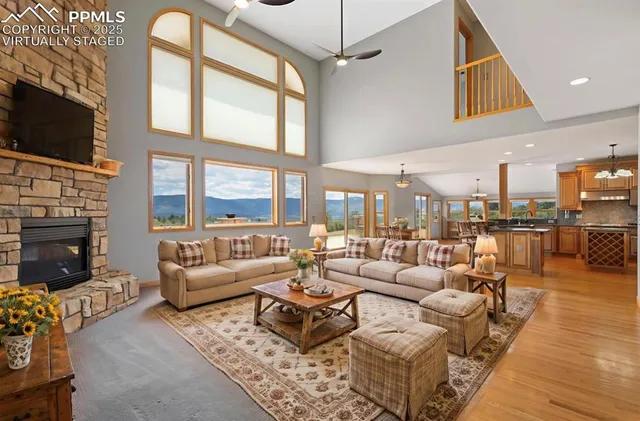 a living room with fireplace furniture and a flat screen tv