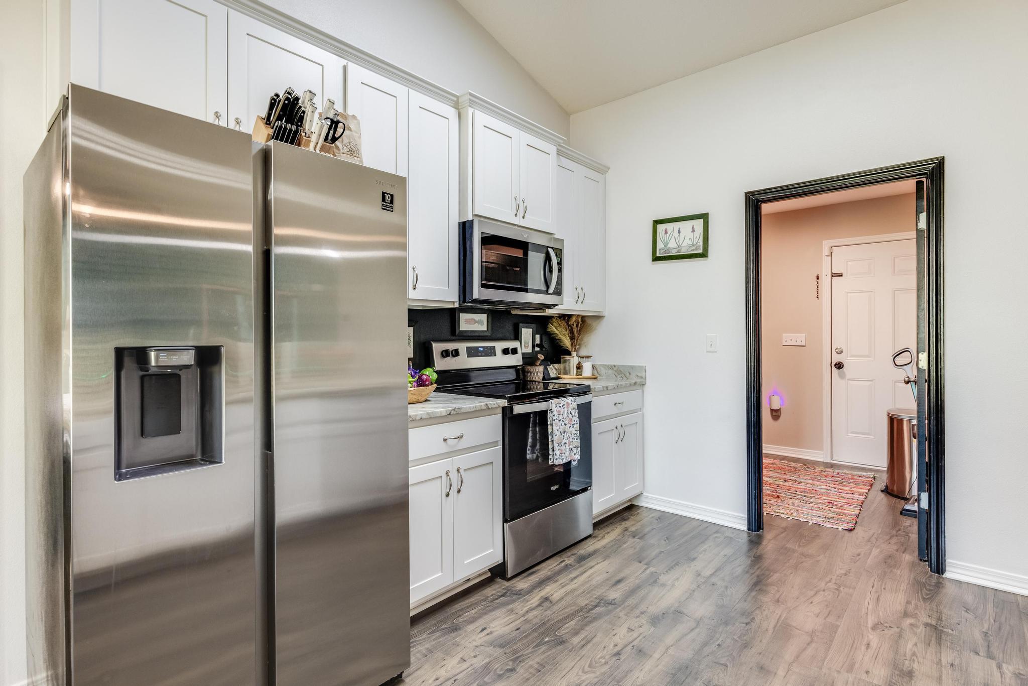 3381 Auburn Road Crestview, FL 32539 - Photo 12 of 46 a kitchen with stainless steel appliances granite countertop a refrigerator and a stove