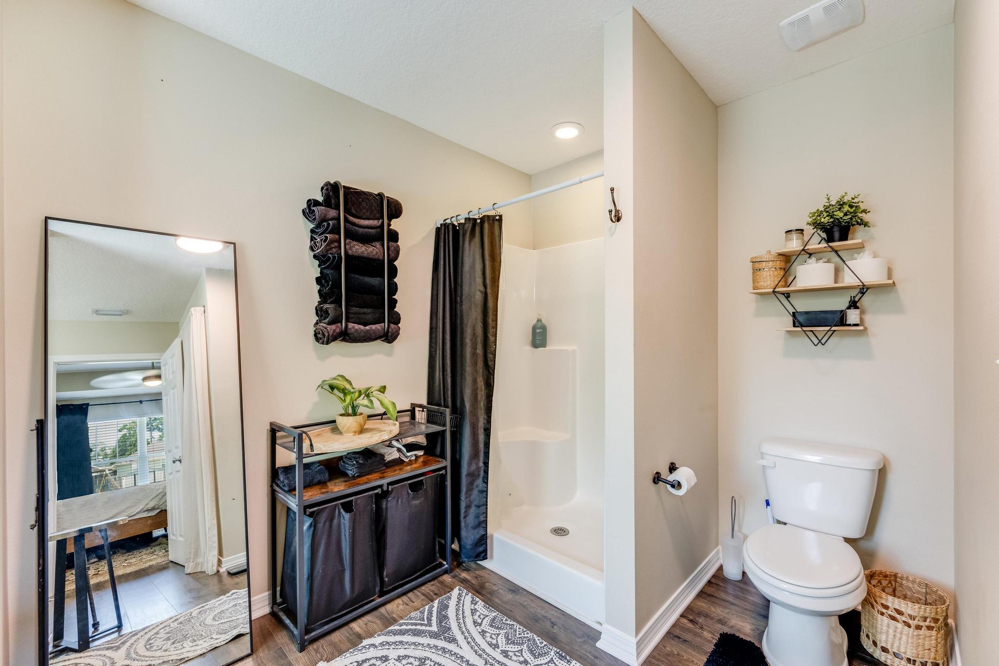 3381 Auburn Road Crestview, FL 32539 - Photo 23 of 46 a bathroom with a sink toilet and shower