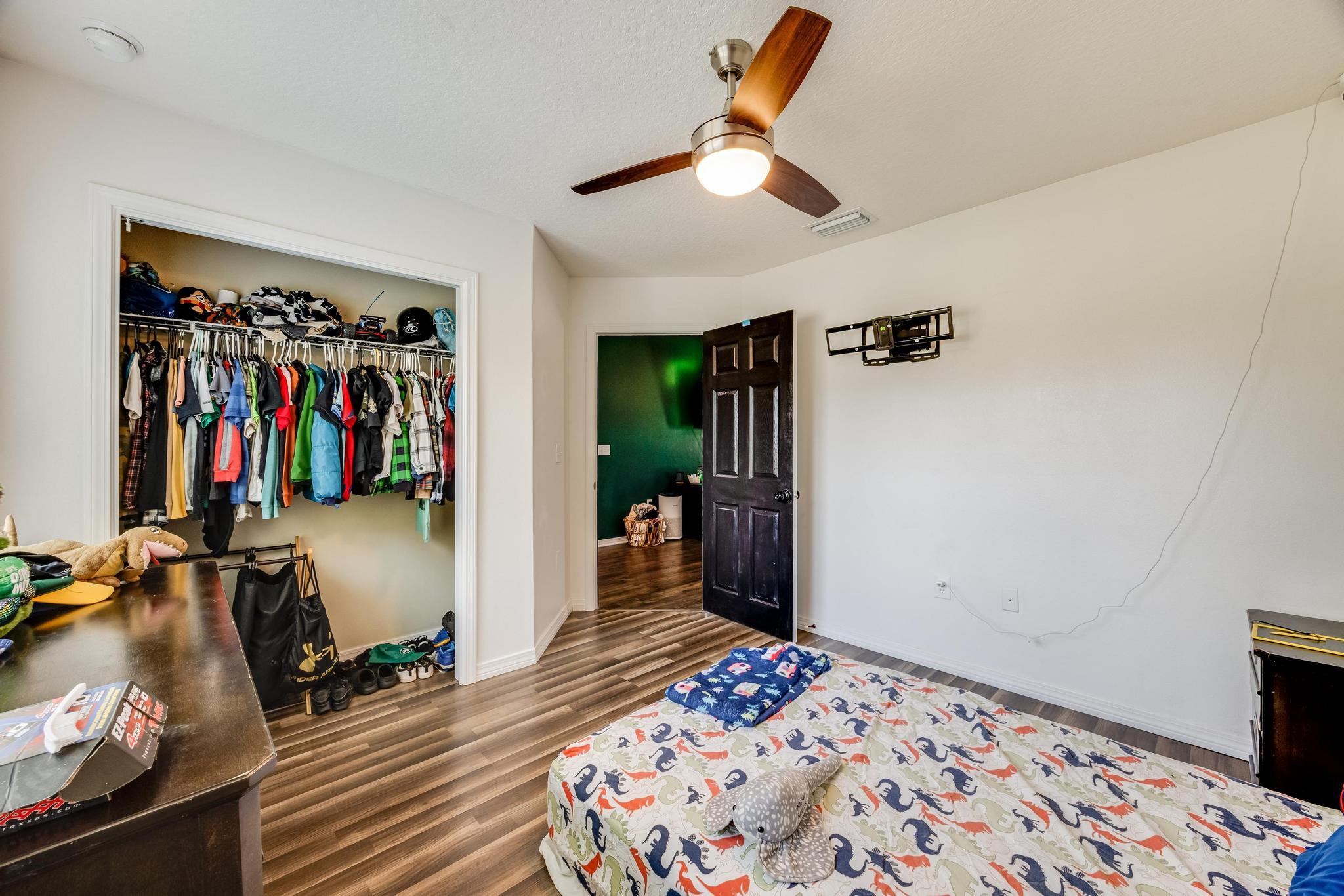 3381 Auburn Road Crestview, FL 32539 - Photo 27 of 46 a bedroom with bed and walk in closet