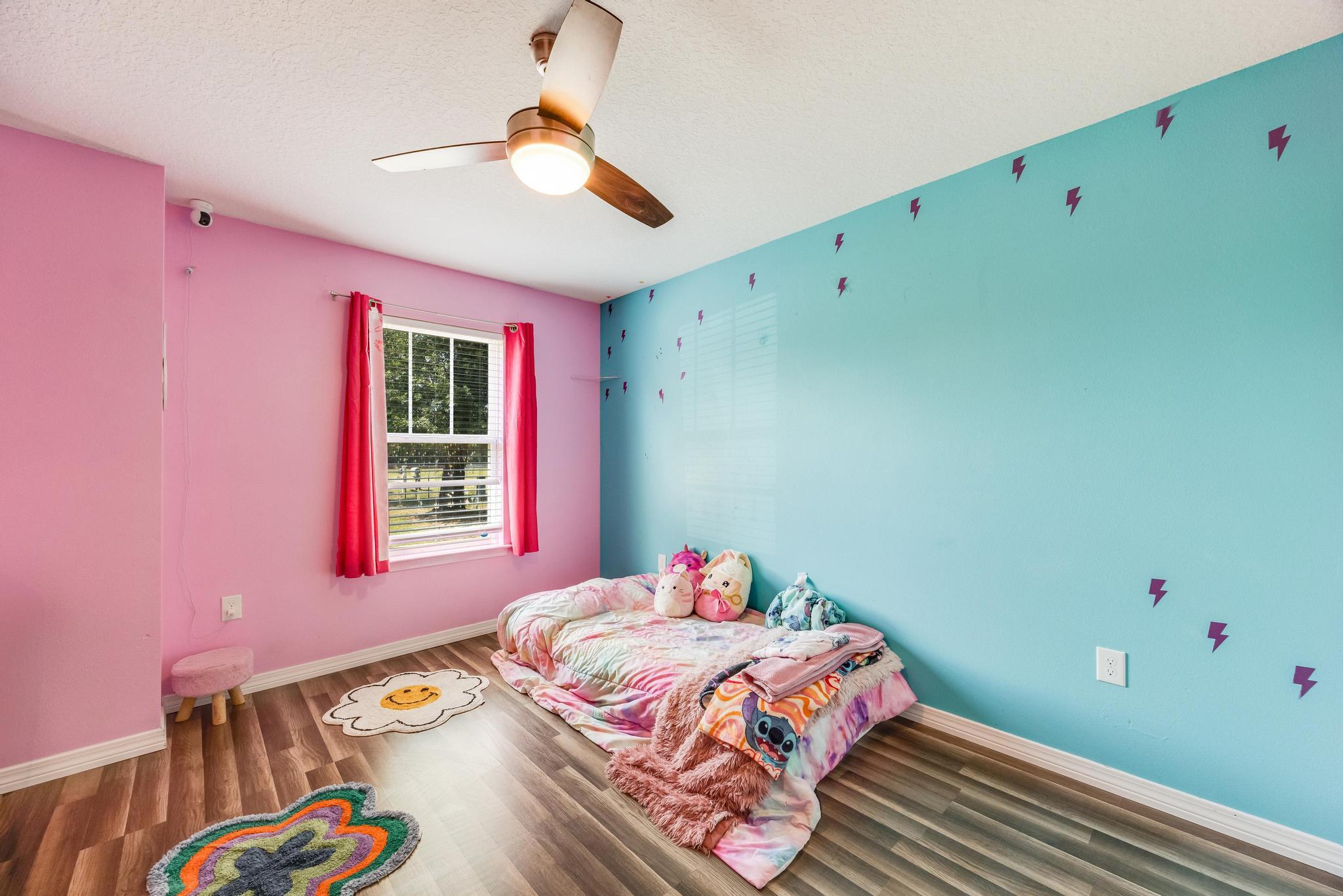 3381 Auburn Road Crestview, FL 32539 - Photo 29 of 46 a bedroom with a bed and a window