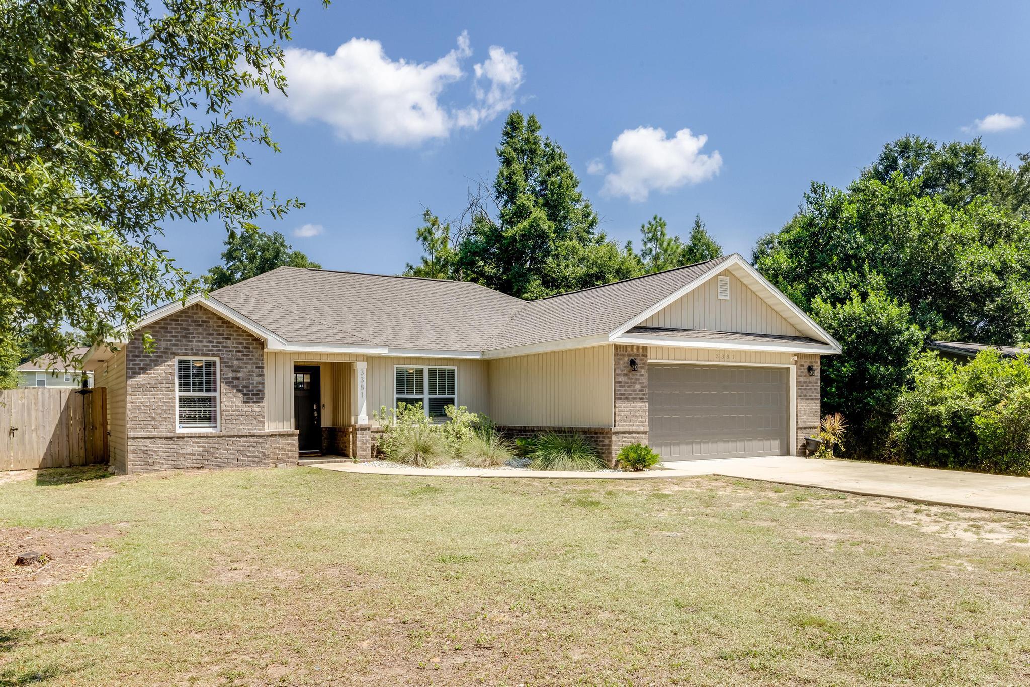 3381 Auburn Road Crestview, FL 32539 - Photo 3 of 46 a view of house with outdoor space and garden