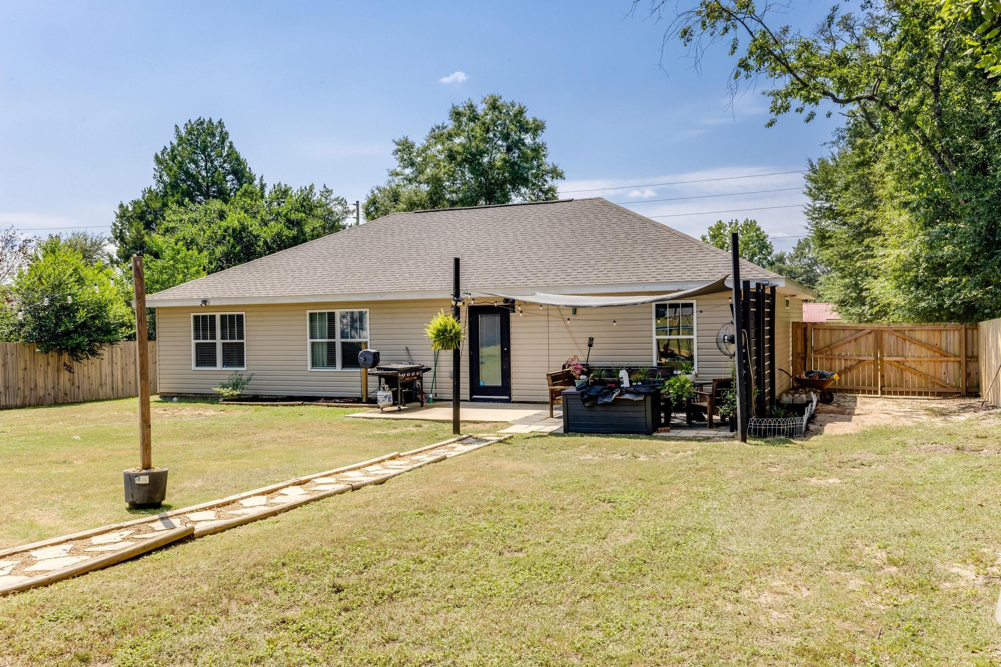 3381 Auburn Road Crestview, FL 32539 - Photo 35 of 46 a view of a house with yard and sitting area