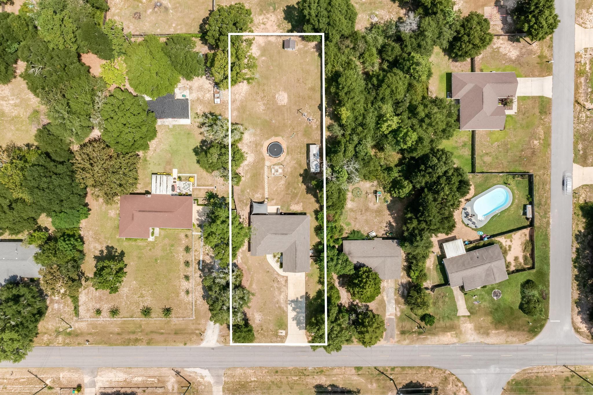 3381 Auburn Road Crestview, FL 32539 - Photo 41 of 46 an aerial view of residential houses with outdoor space and parking