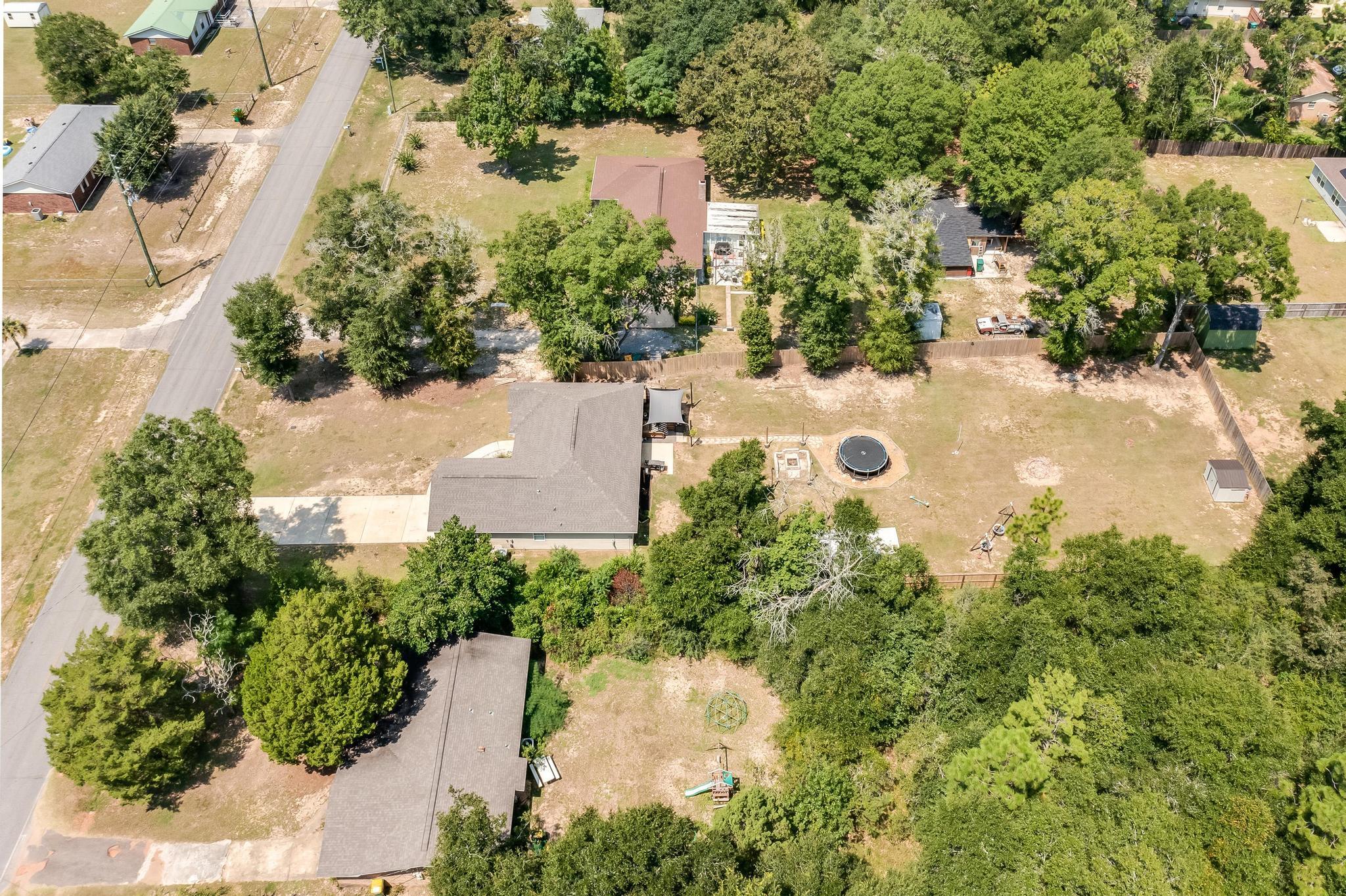 3381 Auburn Road Crestview, FL 32539 - Photo 42 of 46 an aerial view of a house with yard