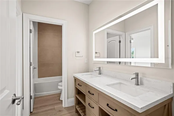 a room with a sink and a mirror