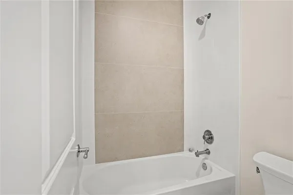 an aerial view of residential house with outdoor space and lake view