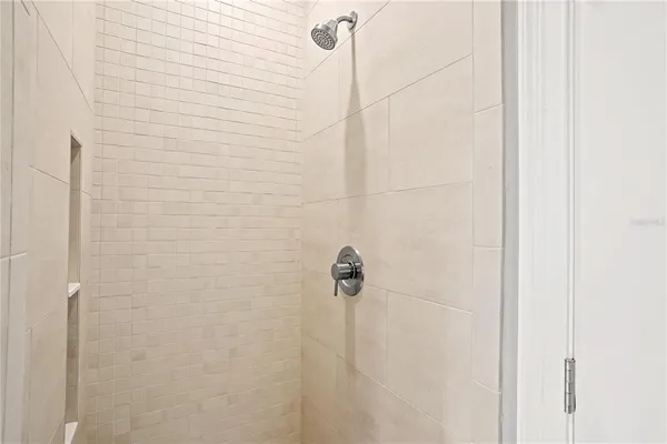 a picture of a bathroom with a shower