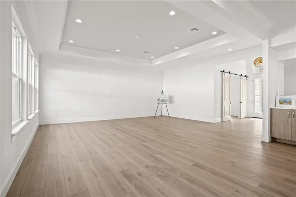 a kitchen with cabinets and steel appliances