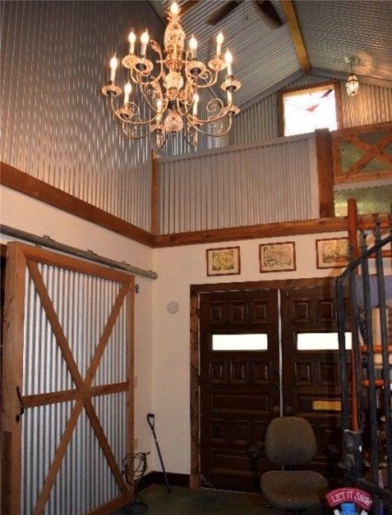 5325 County Road 2291 Centerville, TX 75833 - Photo 20 of 31 Foyer entrance with a high ceiling and a chandelier