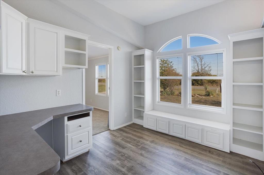 4775 Highway 91 Denison, TX 75020 - Photo 15 of 19 a view of an empty room with a window and wooden floor