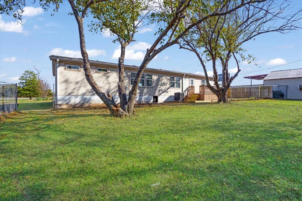 4775 Highway 91 Denison, TX 75020 - Photo 3 of 19 a view of a house with a backyard