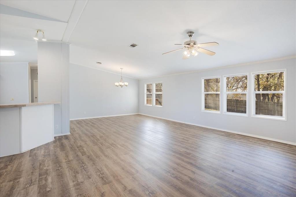 4775 Highway 91 Denison, TX 75020 - Photo 5 of 19 a view of an empty room with a window and wooden floor