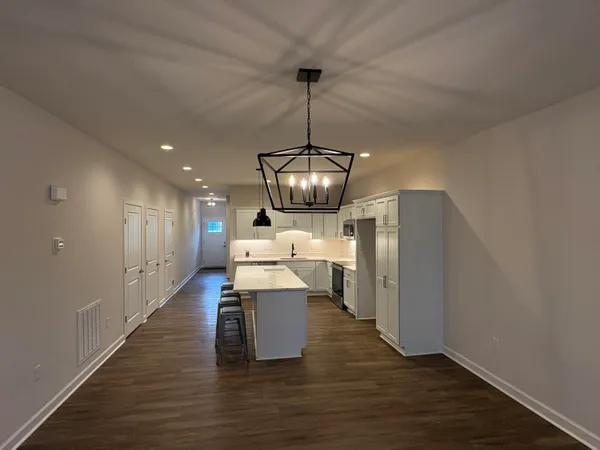 a view of kitchen and dining area with furniture