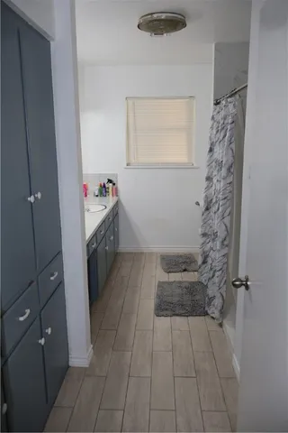 a kitchen with a sink and cabinets