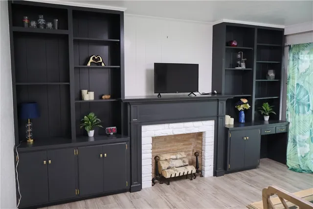 a living room with furniture and a fireplace