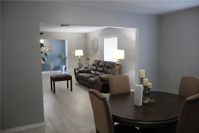 a living room with furniture and a table