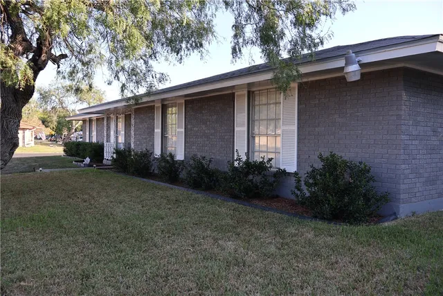 a backyard of a house with lots of green space