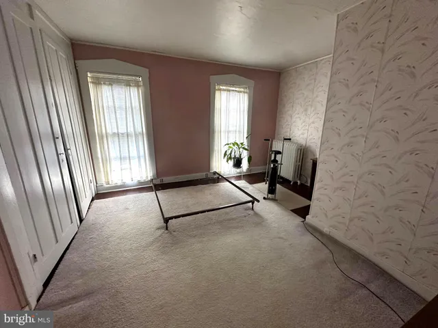 a bedroom with a bed and furniture