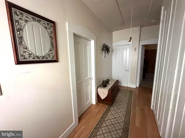 a room with wooden floor and furniture